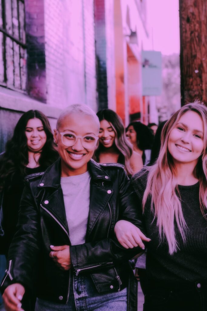 diverse group of female friends walking in the city