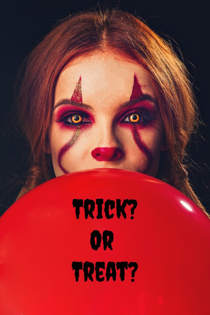 Woman wearing scary clown makeup holding a red balloon