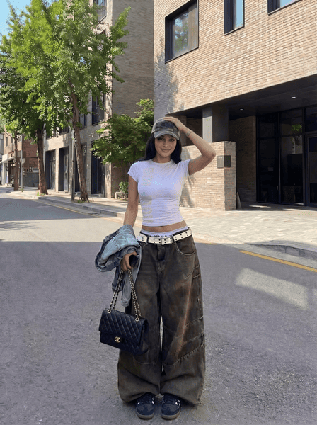 how to look taller in photos-lower the camera before